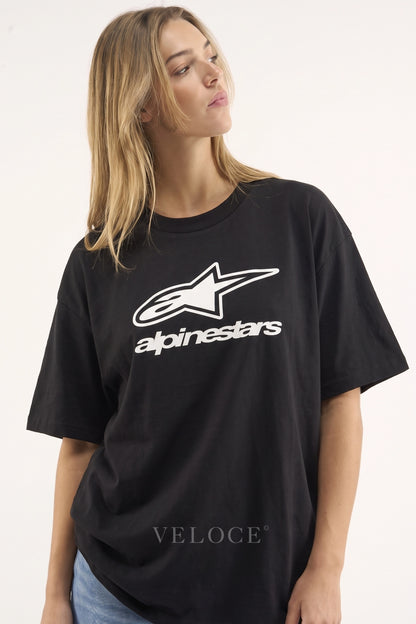 Woman wearing the oversized Alpinestars Racing T-Shirt with the white logo print