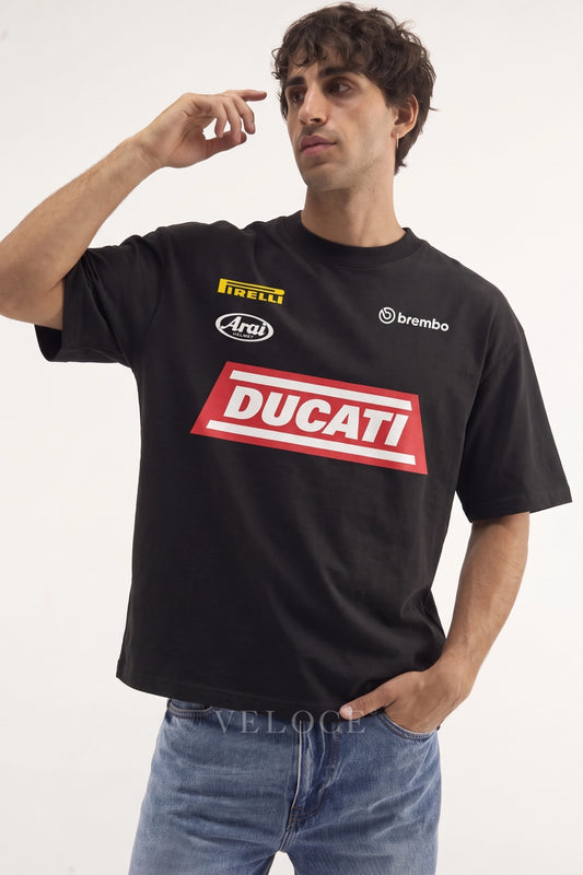Man wearing the black Ducati Racing T-Shirt with the red Ducati block and Pirelli, Arai and Brembo logos