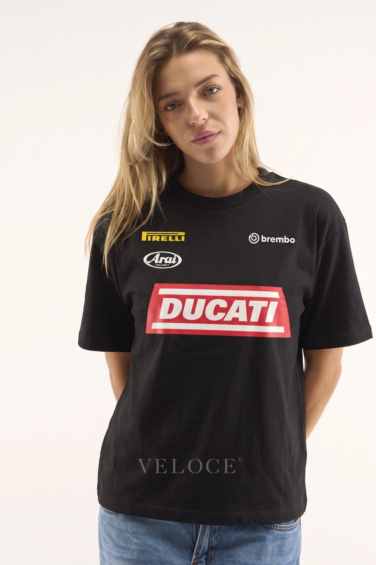 Woman wearing the oversized Ducati Racing T-Shirt with the red Ducati block print