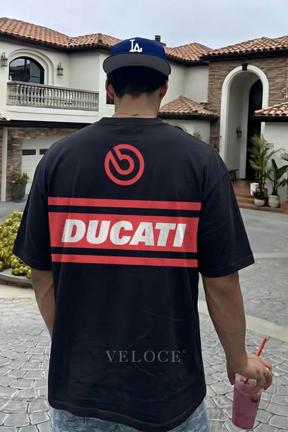 Man walking outdoors wearing the Ducati Racing T-Shirt with the red Ducati back stripe
