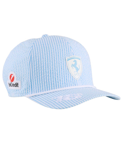 Light blue striped Ferrari F1 2025 seersucker cap at an angle with UniCredit logo and white rope trim