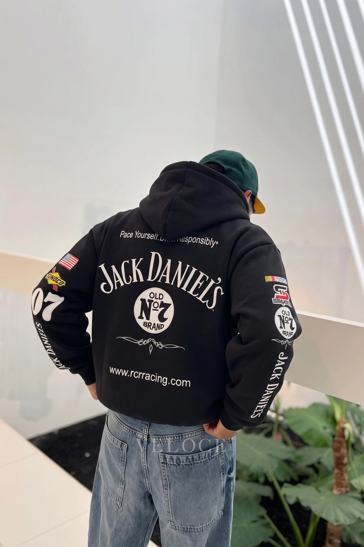 Jack Daniel’s racing hoodie seen from behind indoors