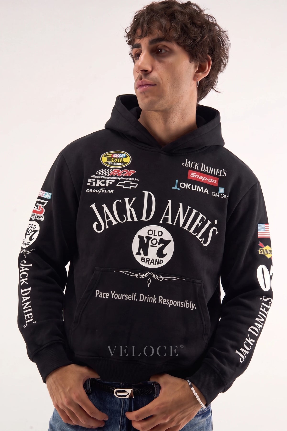 Jack Daniel’s racing hoodie in black worn by a man, embroidered Old No.7 label