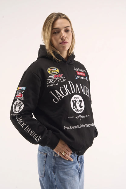 Woman wearing the Jack Daniel’s racing hoodie, front view with the team partner patches