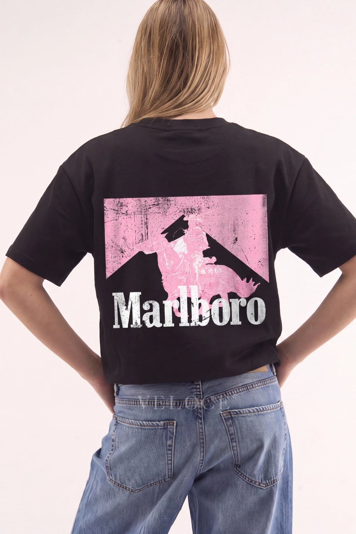 Woman wearing the Marlboro Racing T-Shirt from behind, showing the pink Marlboro Man back print