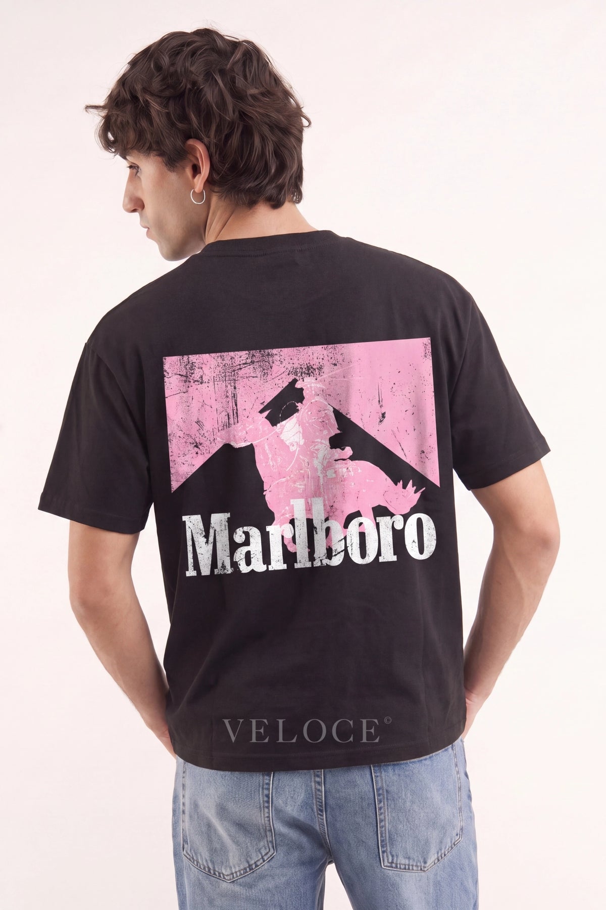 Man wearing the Marlboro Racing T-Shirt from behind, showing the pink Marlboro Man back print