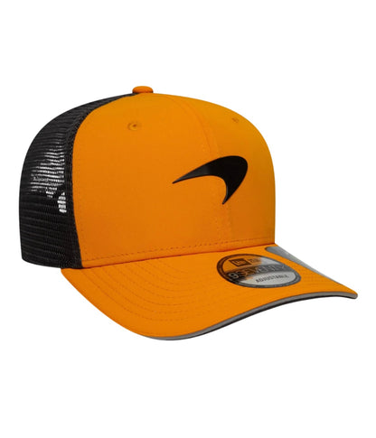 Side angle of the McLaren F1 Team papaya trucker cap with New Era brim sticker