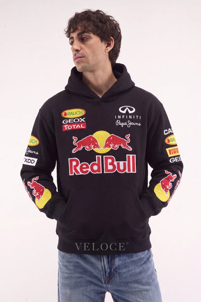 Red Bull Racing F1 hoodie in black worn by a man, embroidered charging bulls on the chest