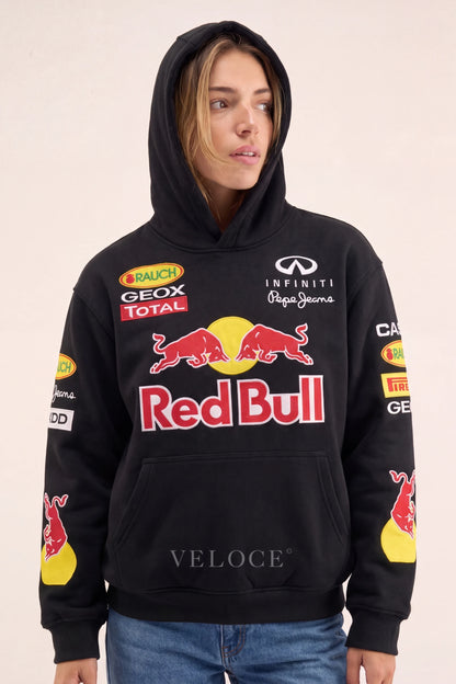 Woman wearing the Red Bull Racing F1 hoodie with the hood up, front view