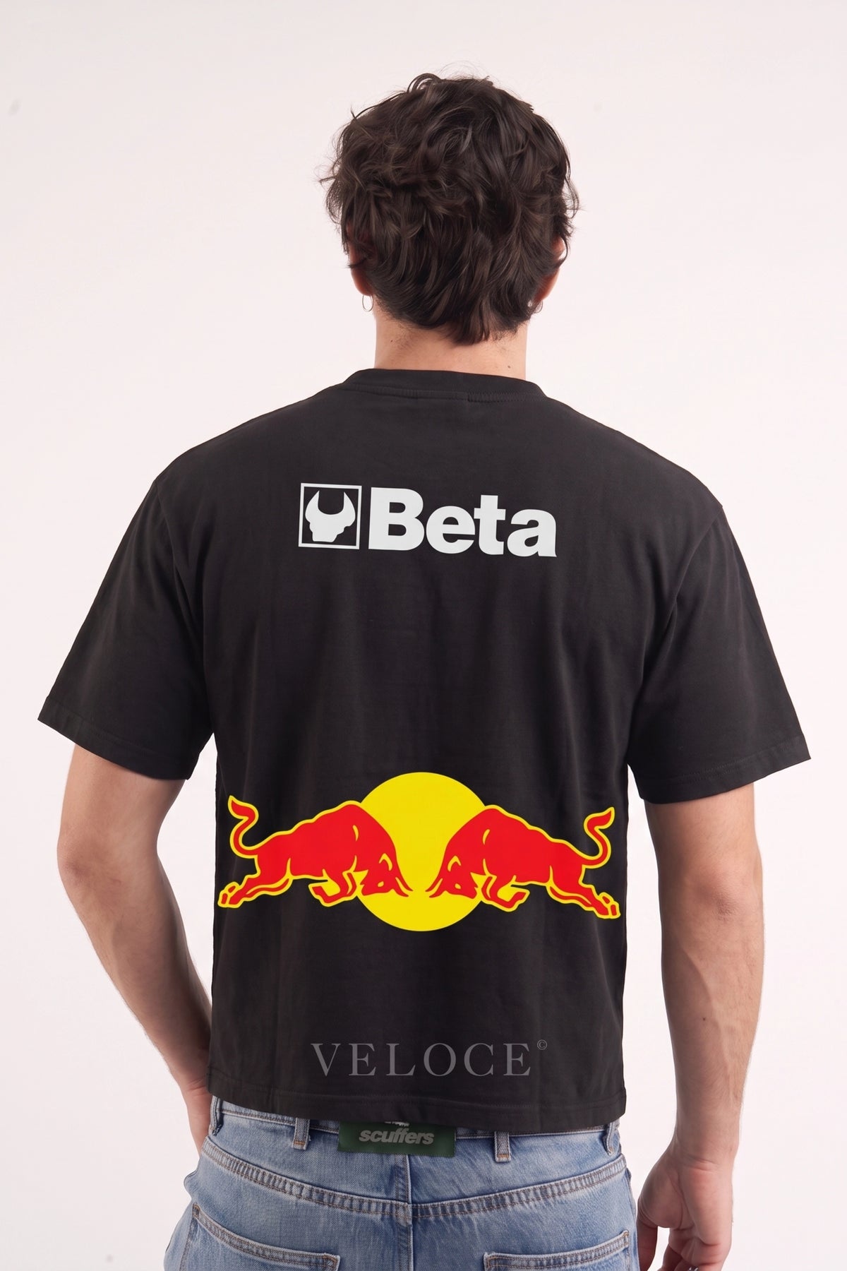 Man wearing the Red Bull Racing T-Shirt from behind, showing the Beta logo and red and yellow bulls print