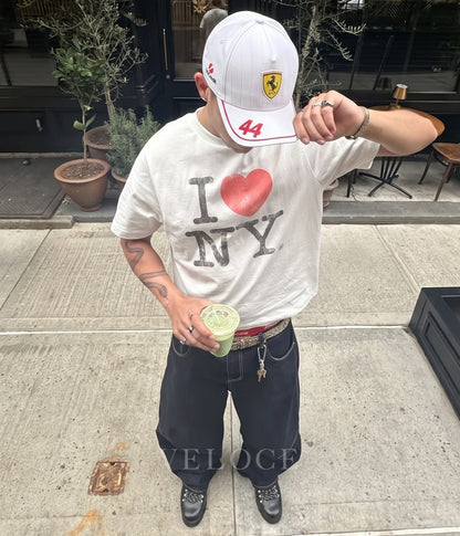 Man wearing the white Scuderia Ferrari F1 embroidered cap with Lewis Hamilton number 44