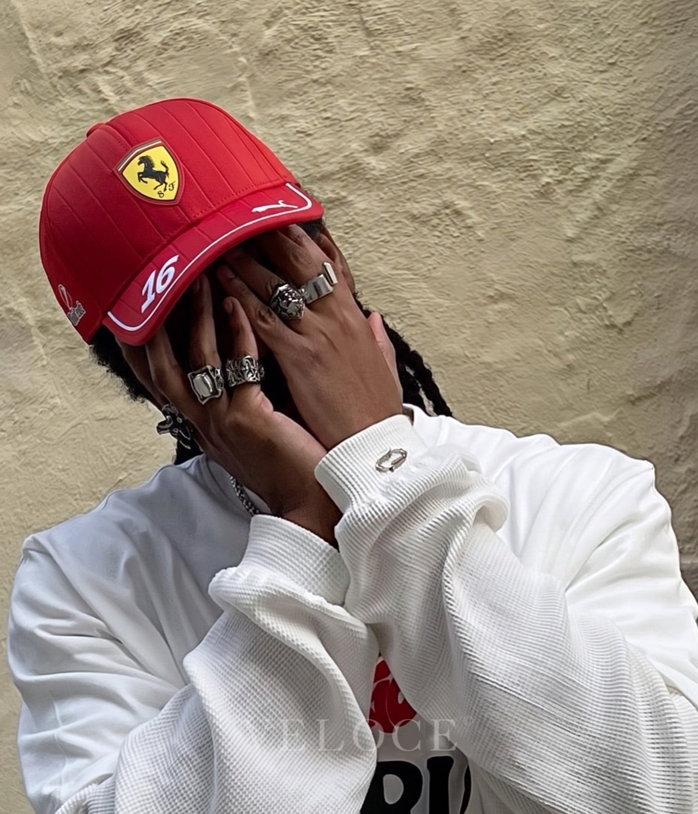 Person wearing the red Scuderia Ferrari F1 embroidered cap with Charles Leclerc number 16