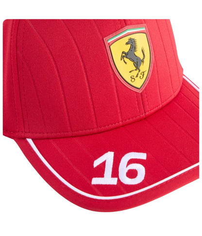 Close-up of the Ferrari shield and embroidered number 16 on the red Scuderia Ferrari F1 cap