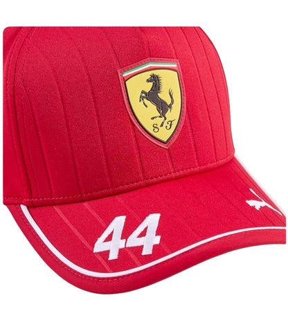 Close-up of the embroidered number 44 and Puma logo on the red Scuderia Ferrari F1 cap